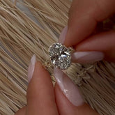 Interweaving Oval Cut Halo Engagement Rings