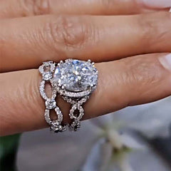 Interwoven Oval Cut Sterling Silver Wedding Sets
