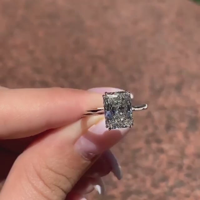 Single radiant stone solitaire under band width